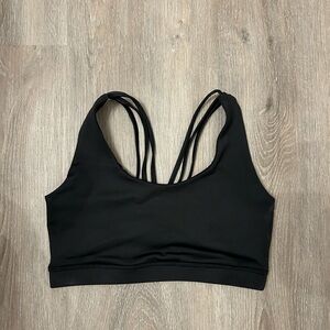 Cute strappy back black sports bra.